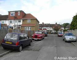 Cars parked on the pavement