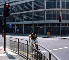 A cyclist going through traffic lights on red