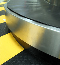 An empty baggage carousel, airport baggage reclaim