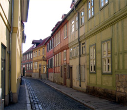 A narrow street with narrow pavements