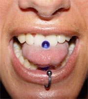 A girl with a pierced tongue and a ring