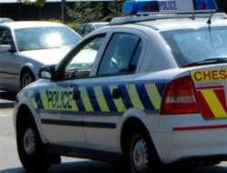 A police car driving through town