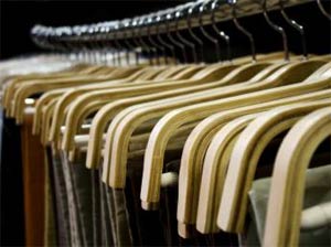 Clothes rack in a clothing retail store, piped music annoying customers