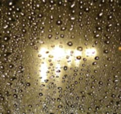 Rain on the road at night