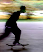 A teenager on a skateboard