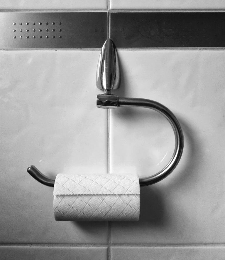 A roll of toilet paper on a holder