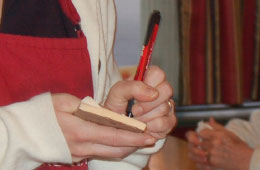 A waitress taking a food order at a restaurant