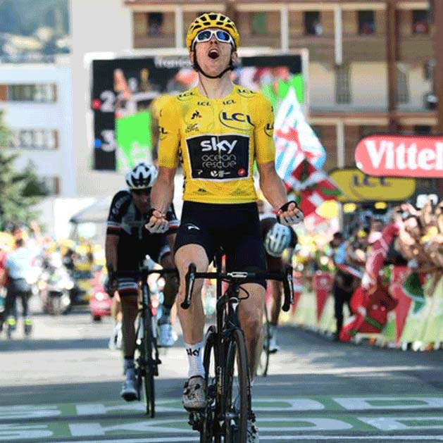 Gerain Thomas celebrates his victory atop Alpe d'Huez in the 2018 Tour de France.