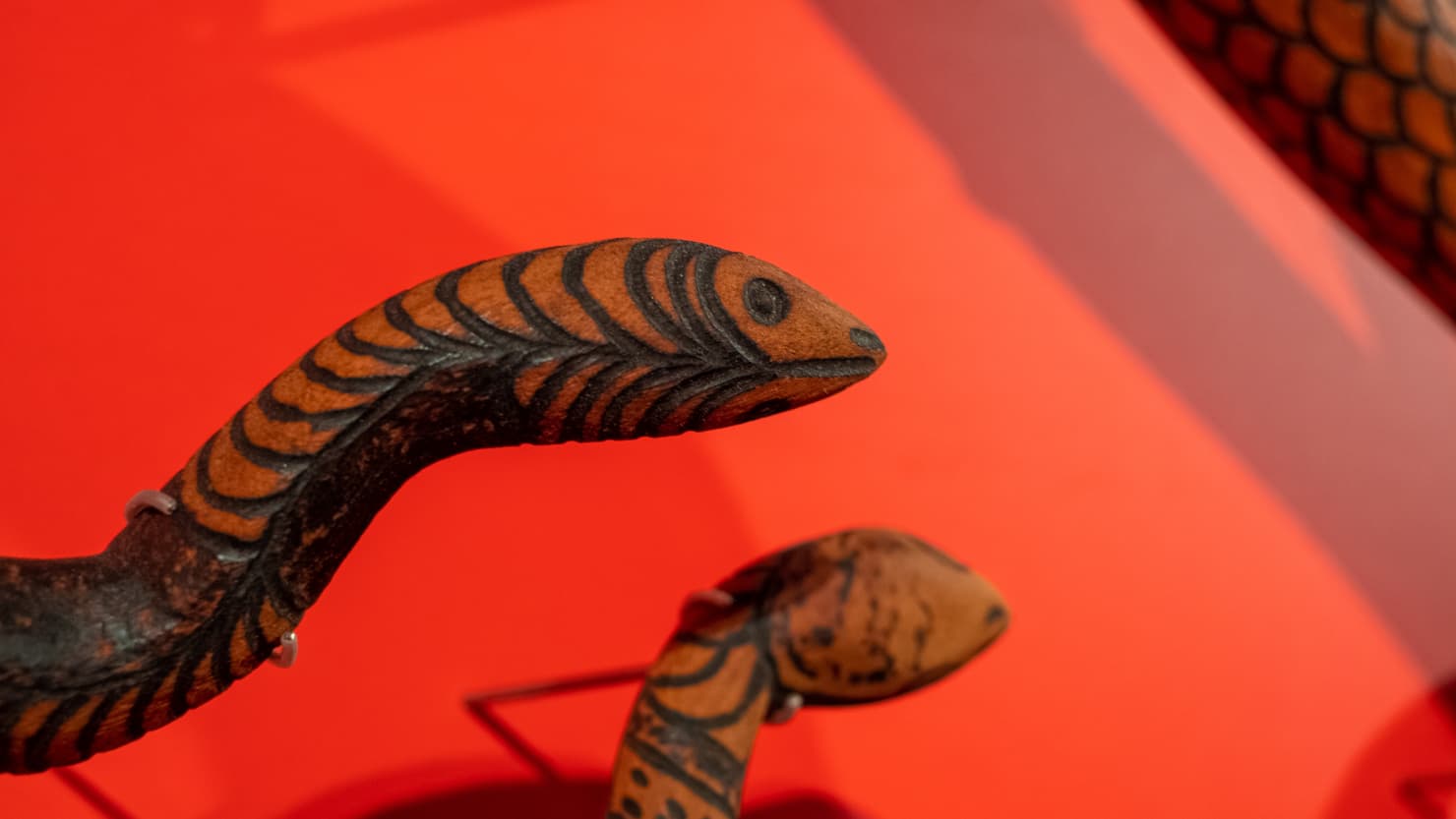 Closeup of wooden snake sculptures