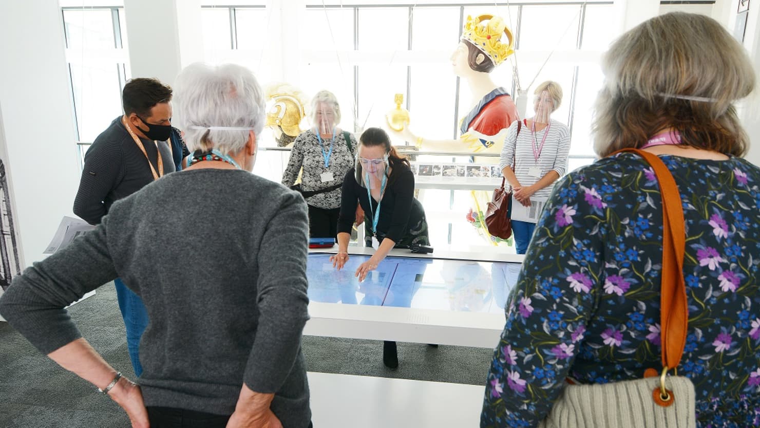 Media Archivist at The Box demonstrating an interactive to visitors