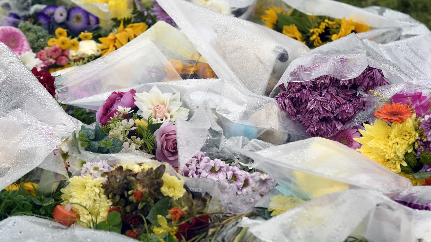 A pile of flowers left in tribute to the victims of the Keyham shootings