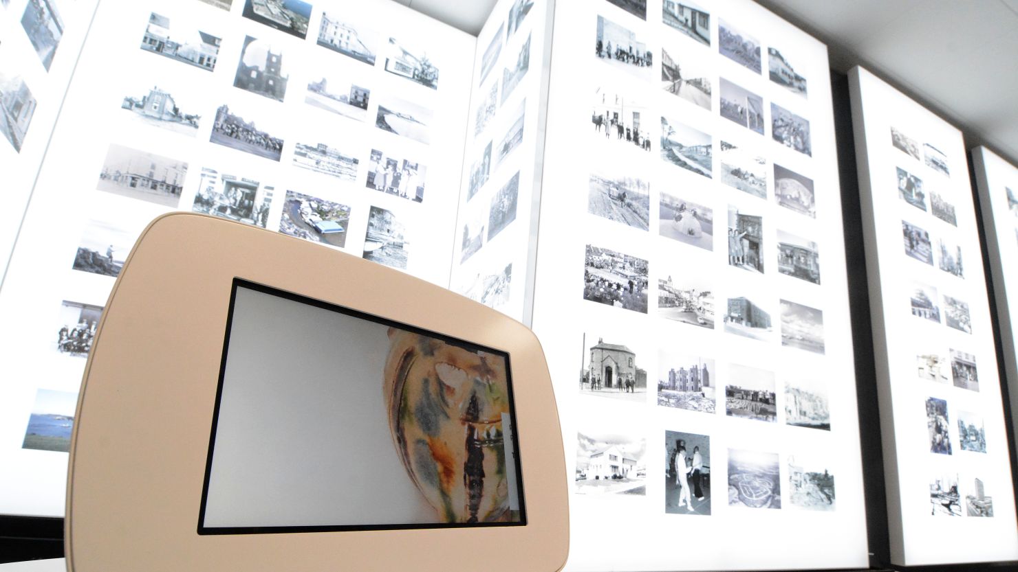 An image of the 'Photo Album' gallery at The Box, Plymouth with images on giant lightboards