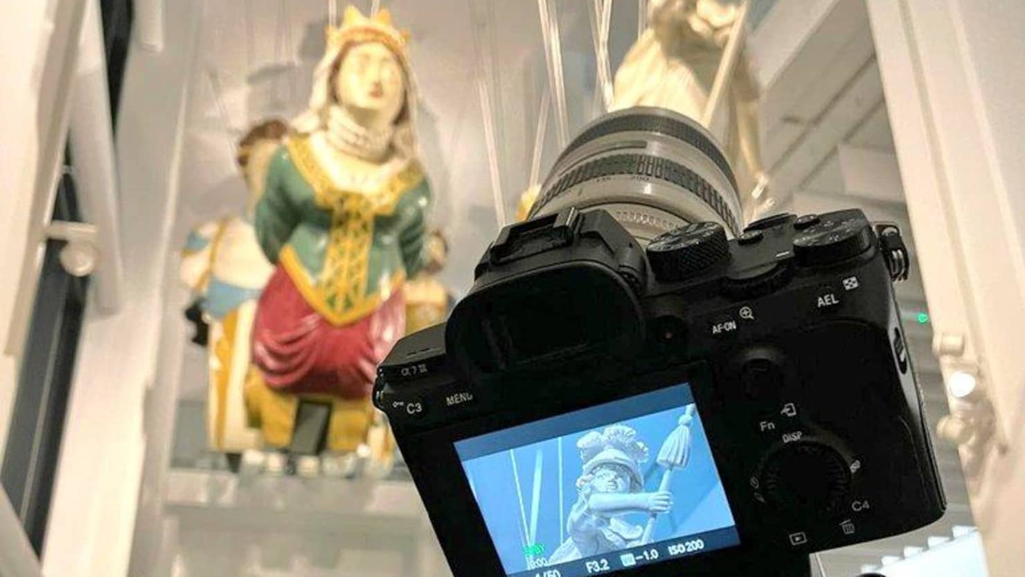 Camera capturing image of figureheads