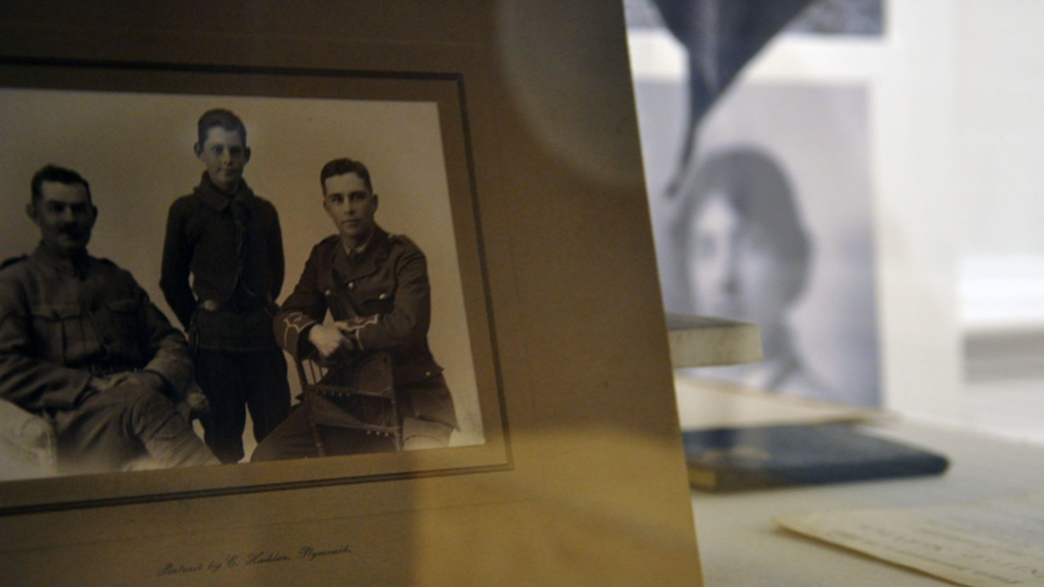 An old black and white photo of a family in uniform