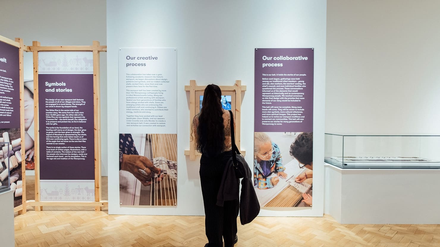 A visitor looking at the Wampum exhibition at The Box, Plymouth
