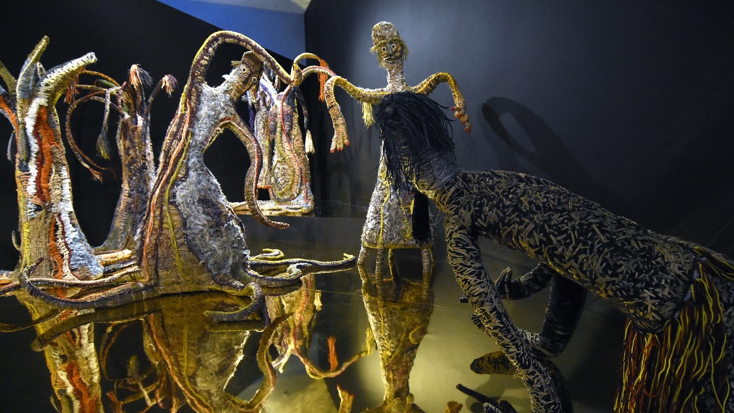 A display of life size woven figures
