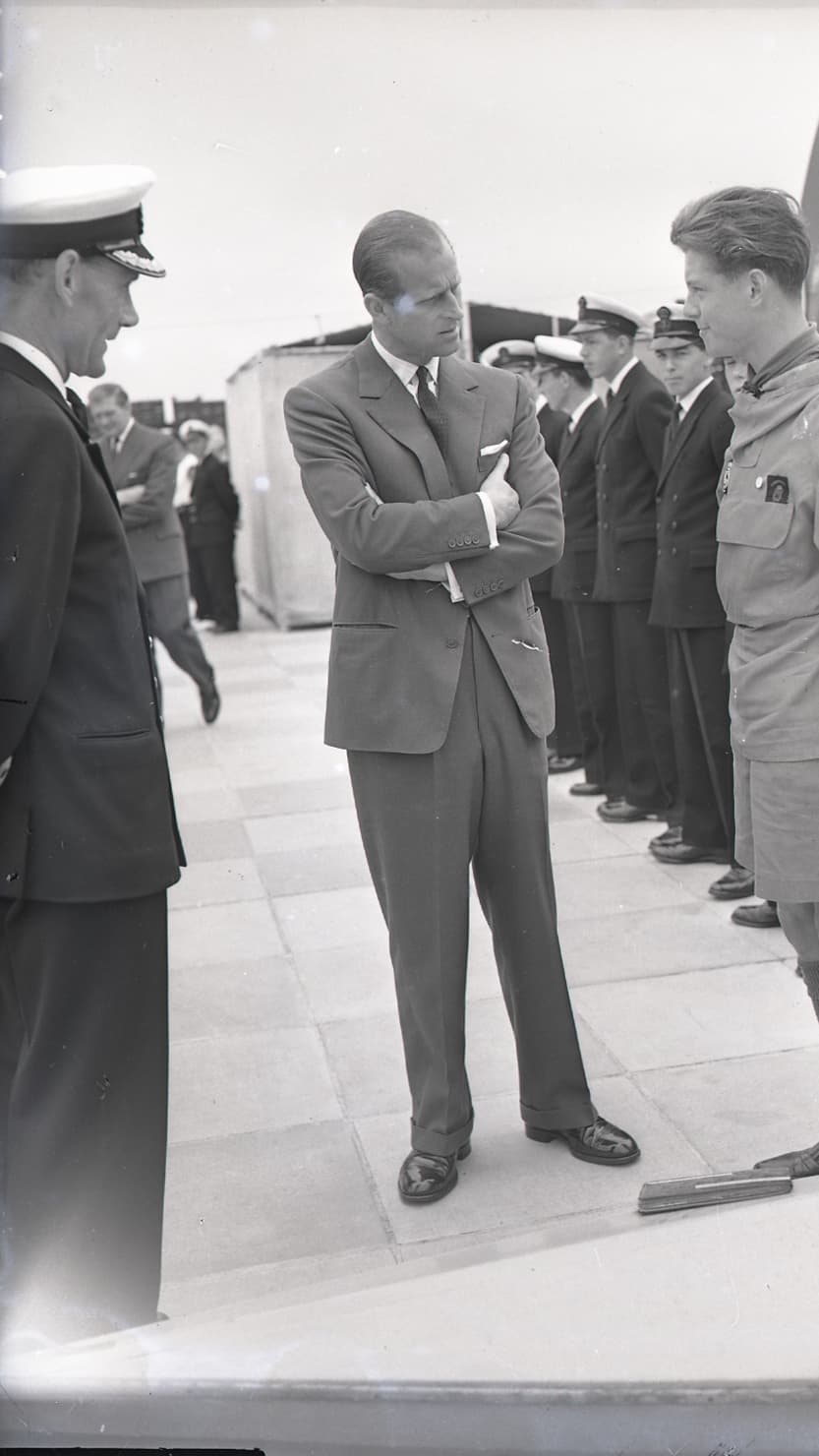 Prince Philip talks to an apprentice at HMS Fisgard, Torpoint on 7 June 1961 © Mirrorpix