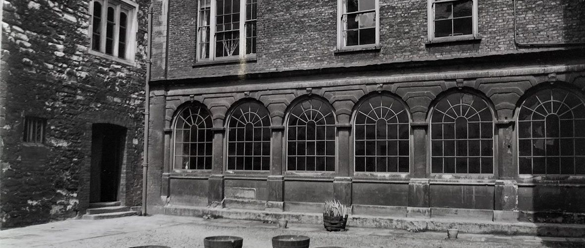 Black and white photo view from outside the chapel cloister