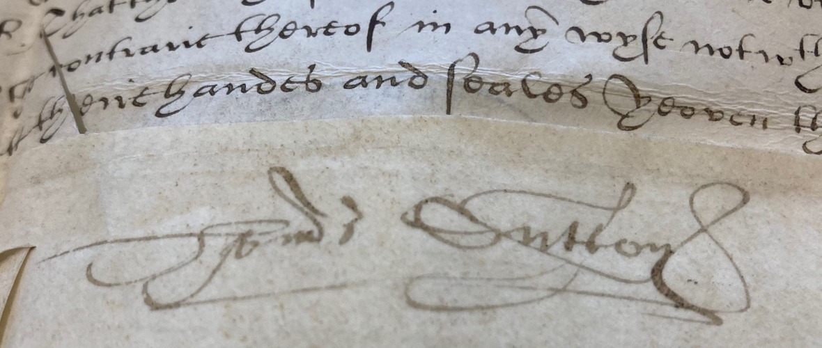 signature and writing on a historic parchment document