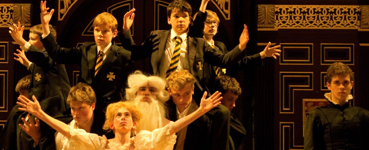 school boys performing in uniforms and costume