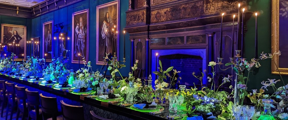 The Great Chamber with a dinner setting featuring flourescent lighting