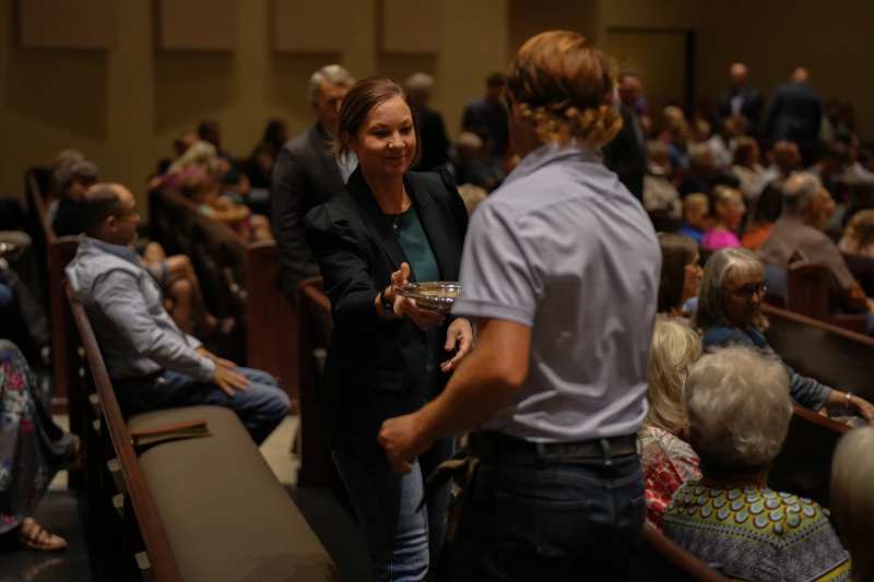 People greeting one another at church