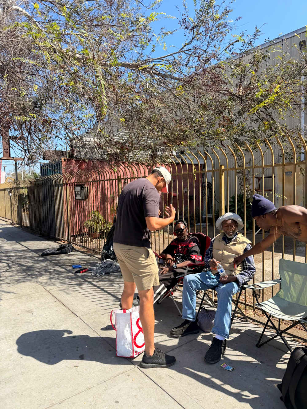 Praying with neighbors during Love Church outreach