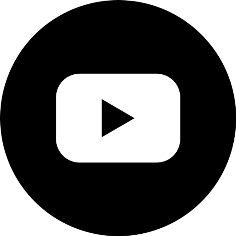 A white YouTube play button logo enclosed within a solid black circle. This is a common social media icon for YouTube.