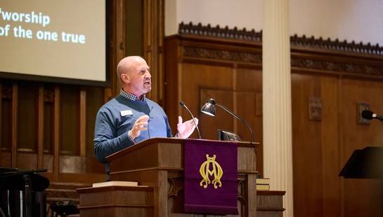 A pastor giving a sermon at Canton Church Abbott Memorial Presbyterian