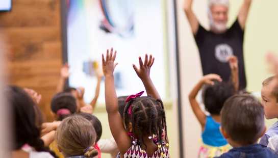 children lifting hands