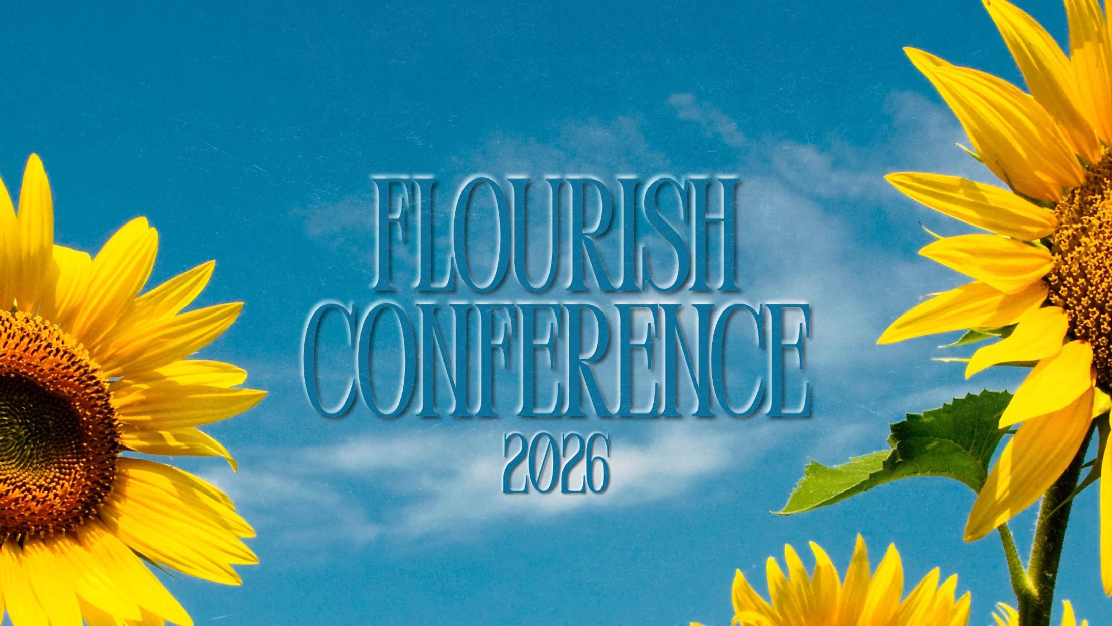 The words 'Flourish Conference 2026' in embossed blue text against a blue sky with clouds, framed by bright yellow sunflowers.