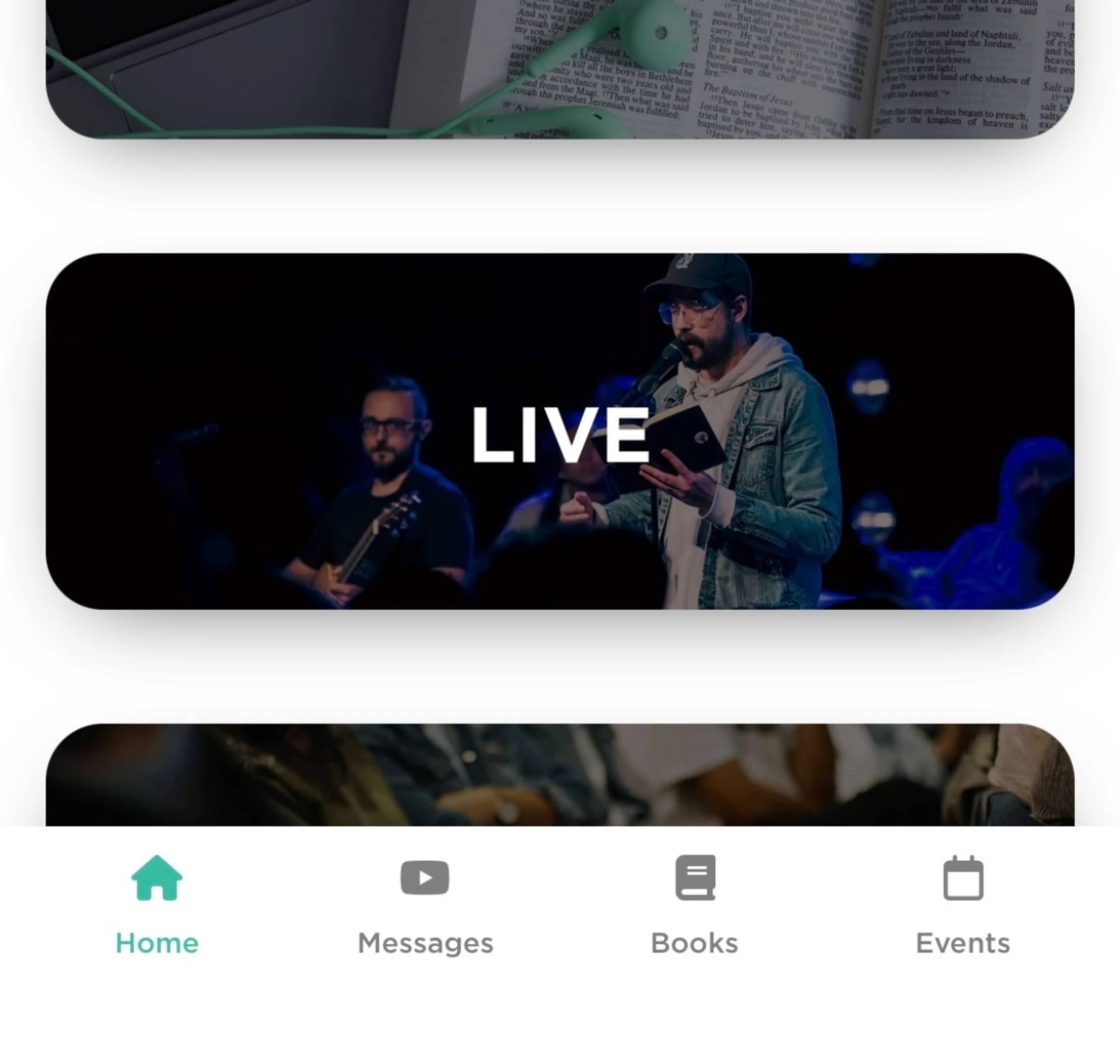 A screenshot of a church's mobile app home screen, featuring a banner for a live service and a navigation bar at the bottom.