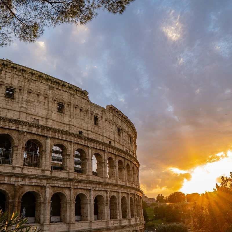 the sun is setting over the roman colossion
