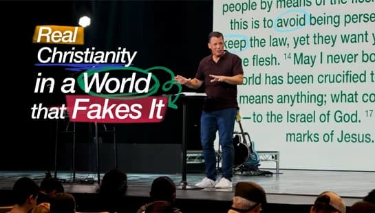 A pastor preaches on stage in front of a screen with Bible verses. A text overlay reads, 'Real Christianity in a World that Fakes It.'