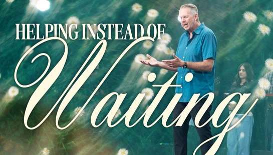 A pastor in a blue shirt preaches on stage with a floral background. Text reads, "Helping Instead of Waiting."
