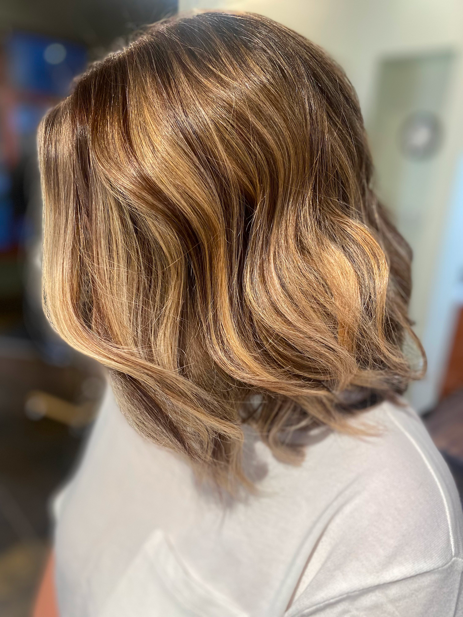 Soft brunette balayage bob styled by Lauren Prost at The Collective salon in Green Bay, Wisconsin.