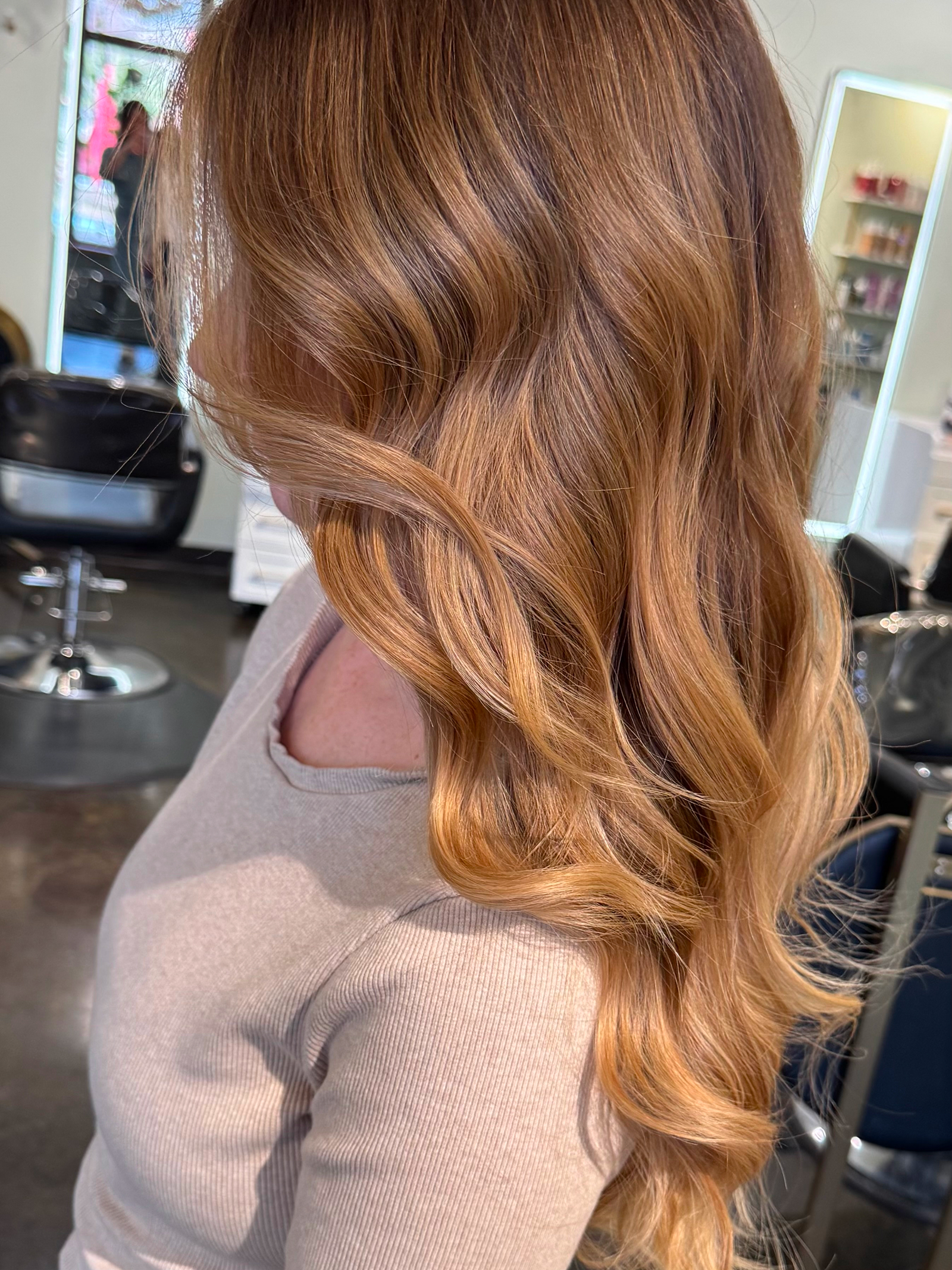 Copper red long waves styled by Lauren Prost at The Collective salon in Green Bay, Wisconsin.