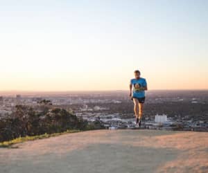 Runner on a trail wearing a hydration vest