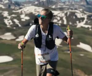 Runner on a trail wearing a hydration vest