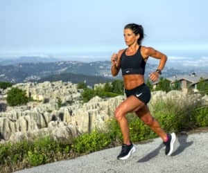 Runner on a trail wearing a hydration vest