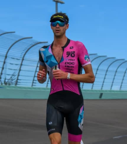 Cyclist on a road with The Feed helmet