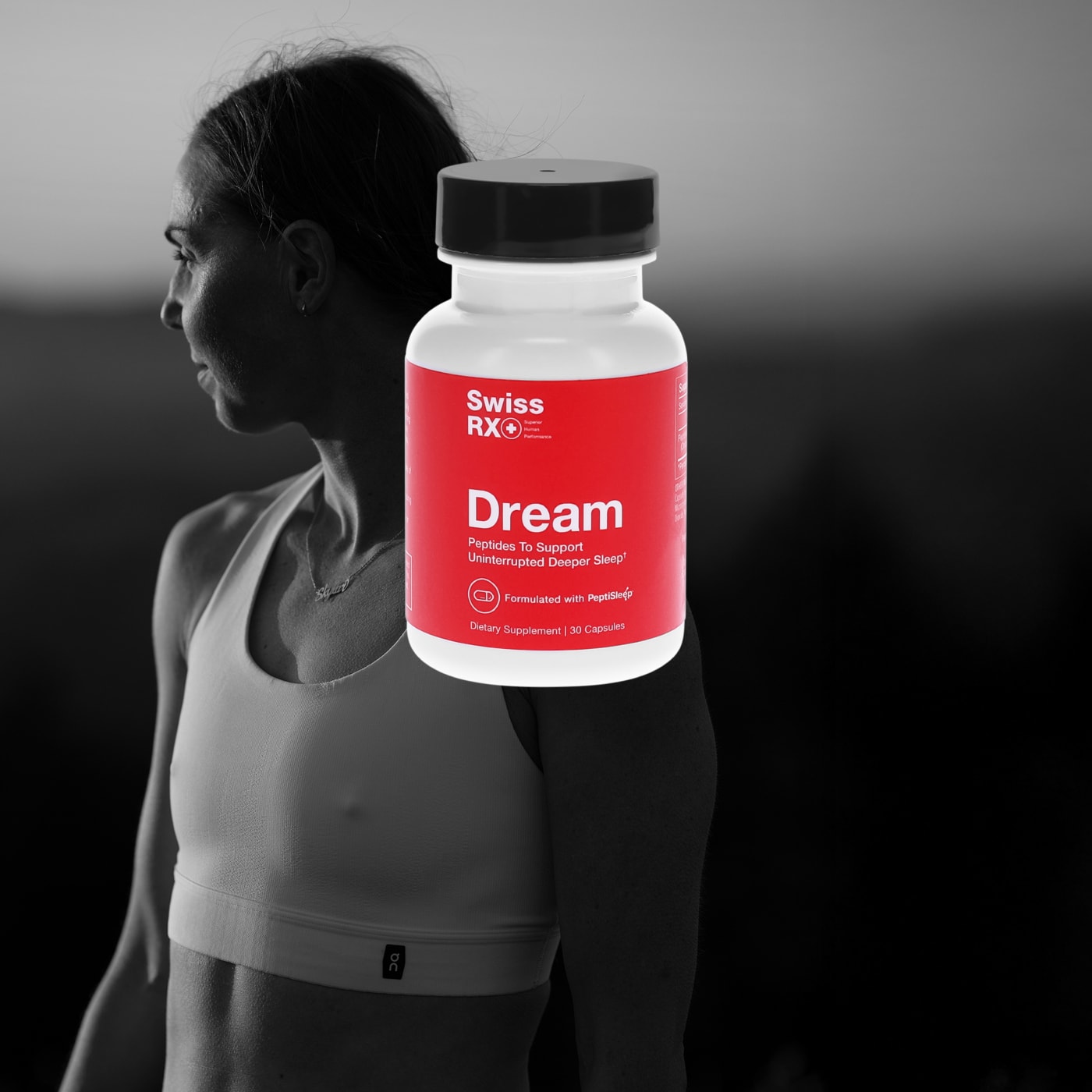 SwissRX Dream supplement with PeptiSleep peptides to support uninterrupted deep sleep, white bottle with red label over black and white image of athlete in sports bra