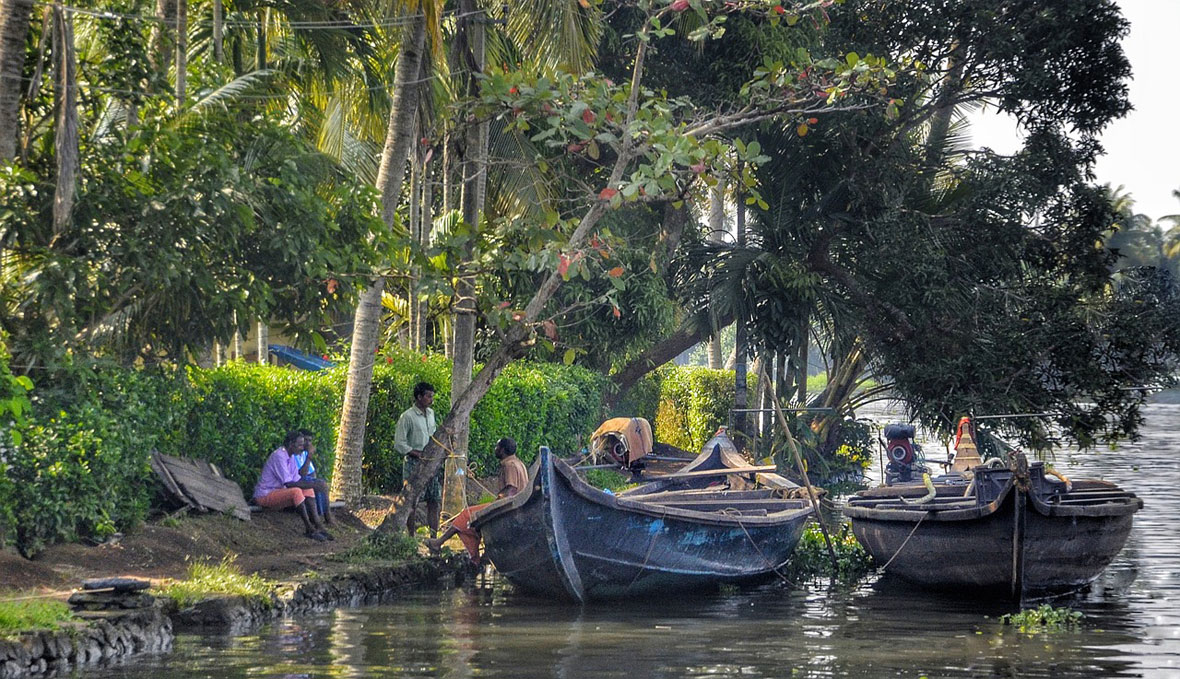 villagers talking backwaters wooden in Kerala