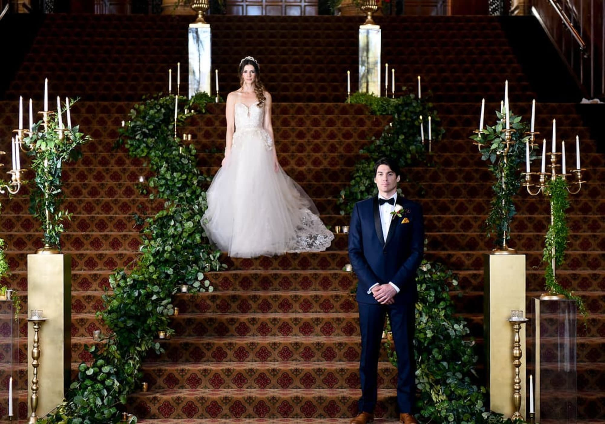 A bride and groom on steps