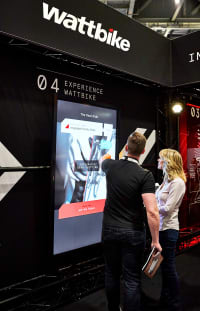 Photograph of a Wattbike staff member using the touchscreen