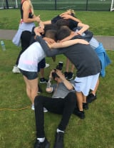 A group of young children getting their photo taken as a group.