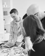 Team around a table discussing research findings