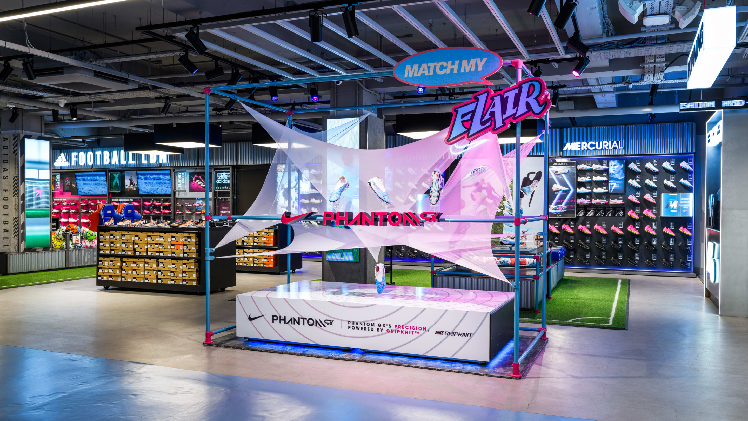 Retail display showcasing Nikes football boot launch, the Phantom GX, in Sports Direct