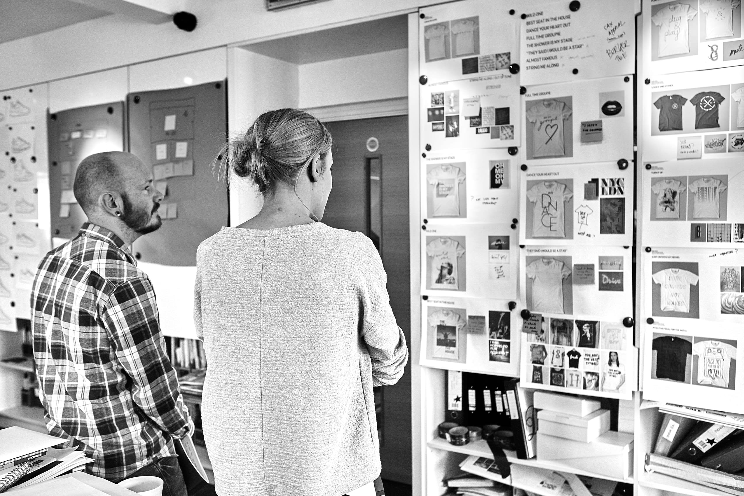 Reviewing work on the studio wall