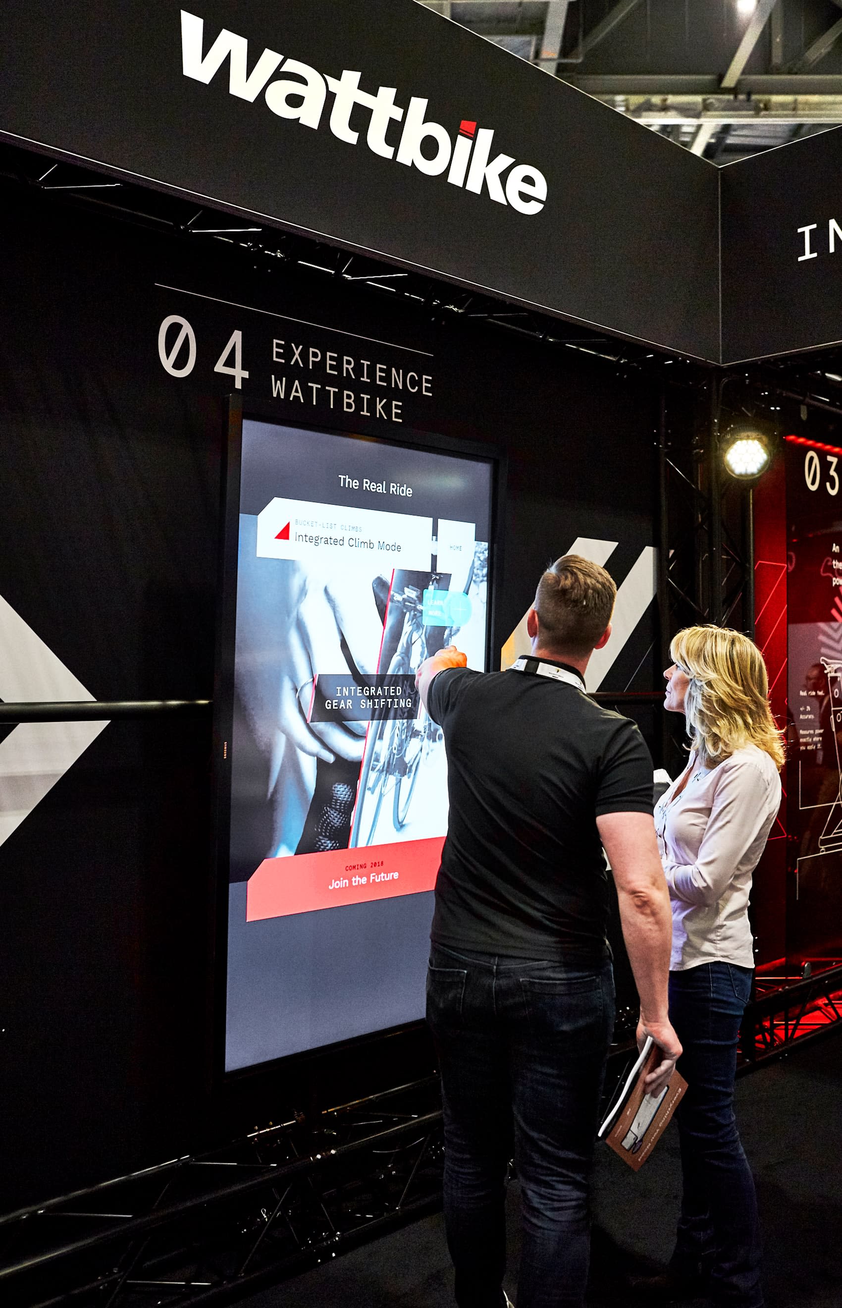 Photograph of a Wattbike staff member using the touchscreen